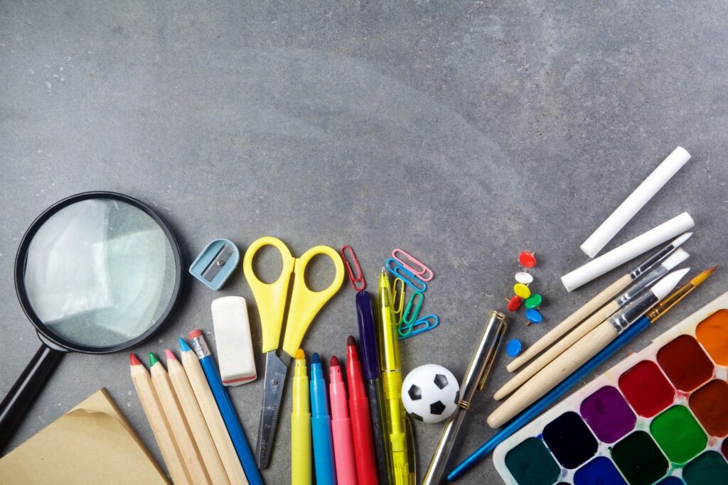 school supplies on blackboard background